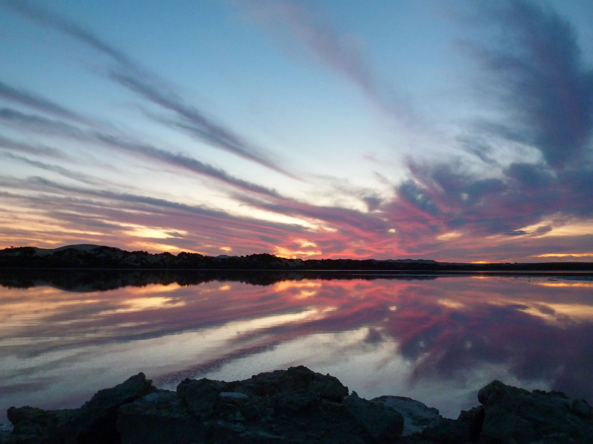 November sunset over pink salt lake